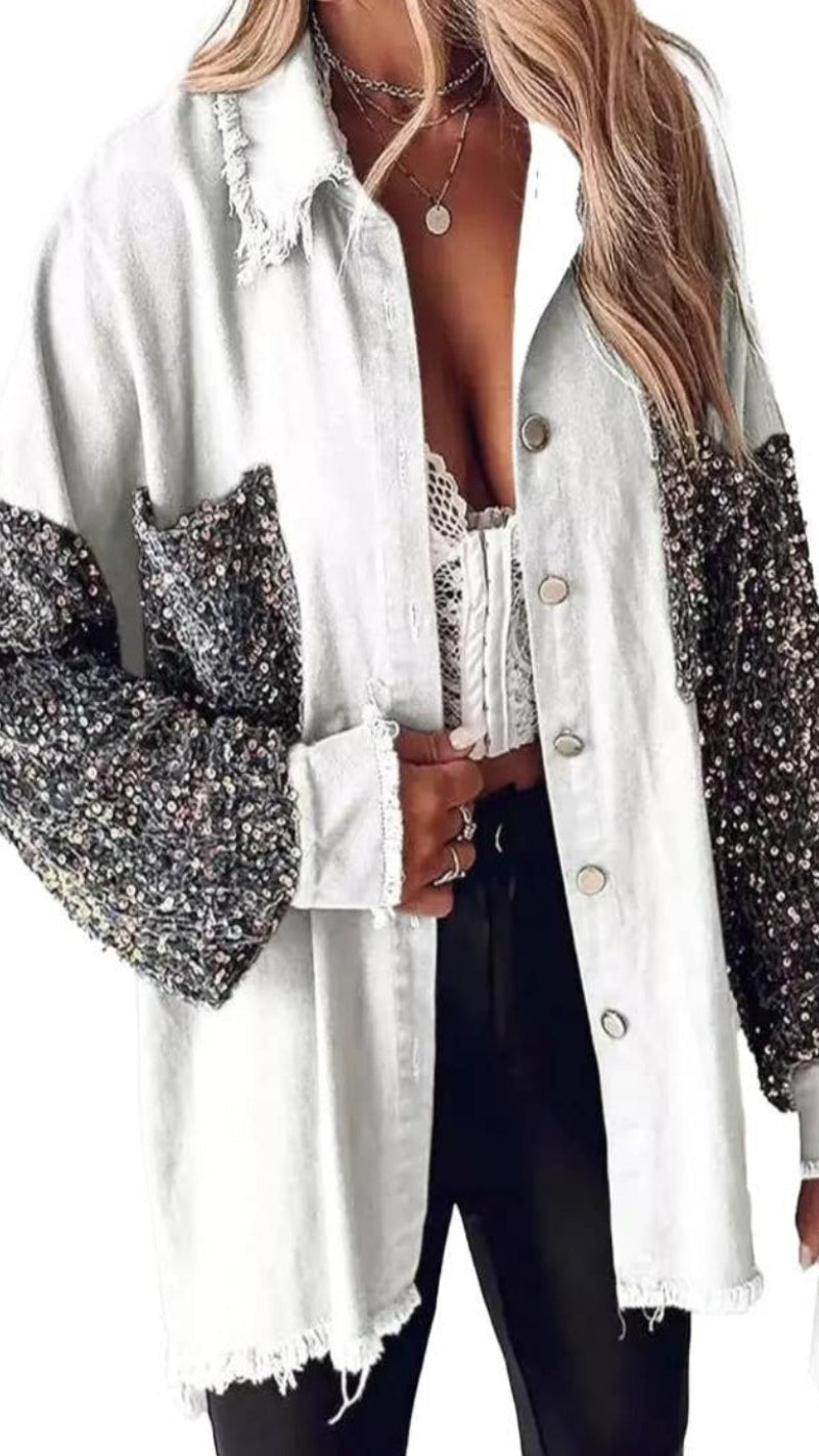 White shirt with sequin sleeves worn by a person on a white background